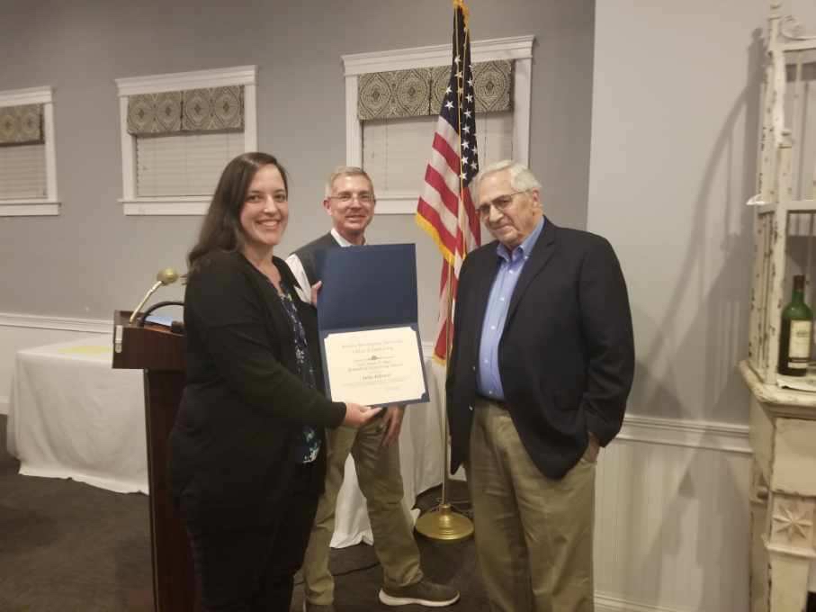 Student receiving award with Dr. Gettens